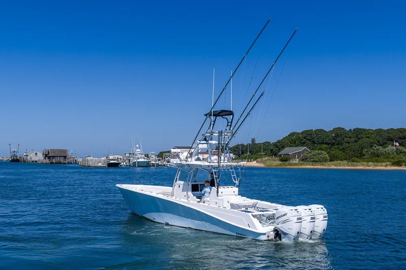 Fear N Money Yacht Photos Pics 2019 Concept 392 ProFish boat with triple engines on a sunny day near the shore.