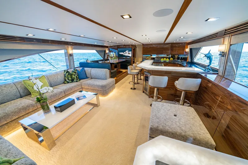 2026 Viking 90sb Yacht Photos Pics Luxurious interior of 2026 Viking 90 Sky Bridge yacht with elegant seating and ocean views.