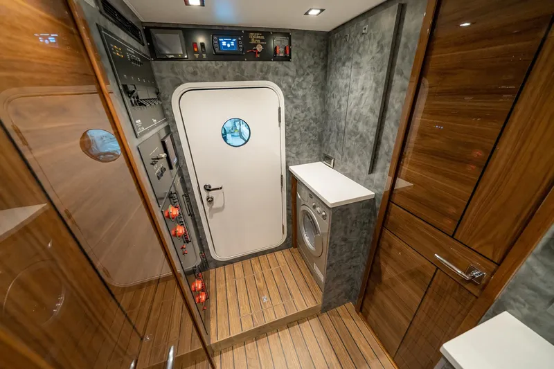 2026 Viking 90sb Yacht Photos Pics Interior of 2026 Viking 90 Sky Bridge yacht with control panel and washer.