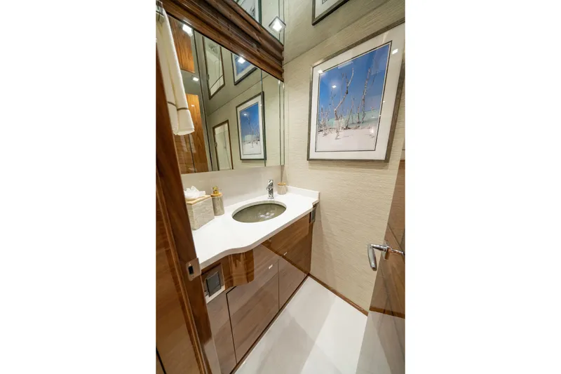 2026 Viking 90sb Yacht Photos Pics Luxurious bathroom in 2026 Viking 90 Sky Bridge yacht with modern fixtures and elegant decor.