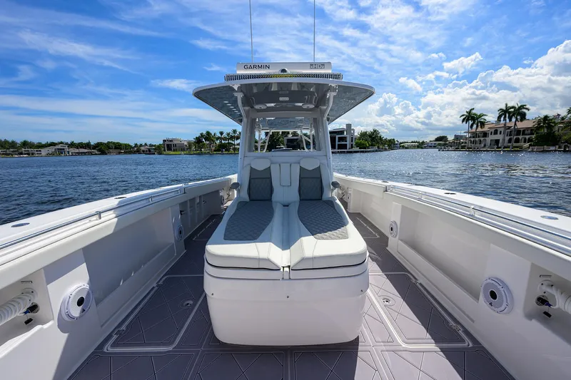 Argento II Yacht Photos Pics 2023 Invincible 46 Catamaran on water, showcasing spacious deck and seating.