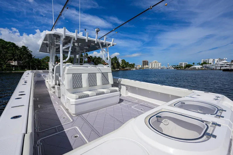 Argento II Yacht Photos Pics 2023 Invincible 46 Catamaran on water, showcasing spacious deck and seating.