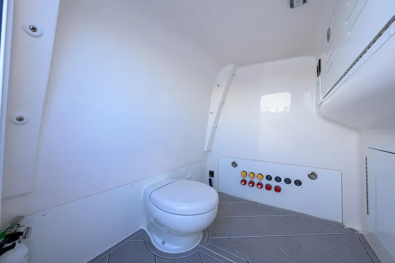 Argento II Yacht Photos Pics 2023 Invincible 46 Catamaran interior bathroom with modern fixtures and control panel.
