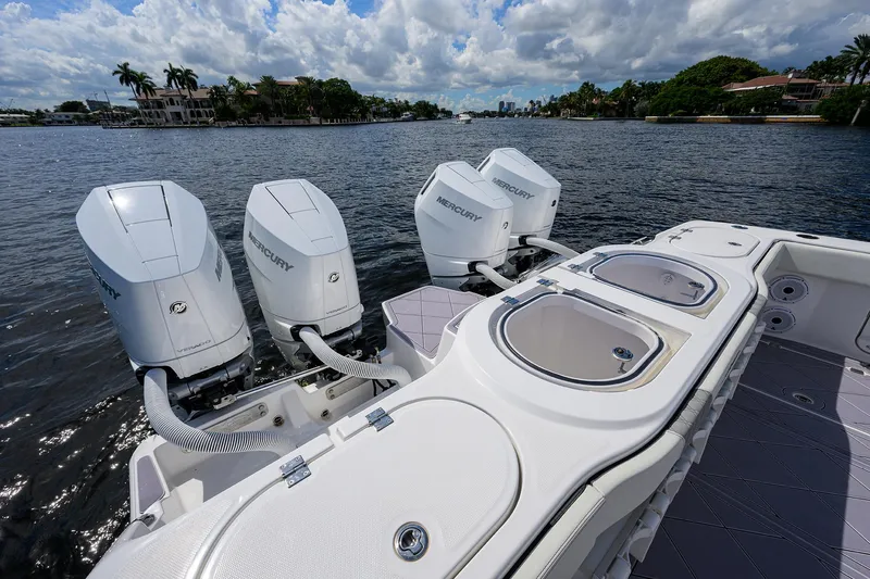 Argento II Yacht Photos Pics 2023 Invincible 46 Catamaran with four powerful outboard engines on a scenic waterway.