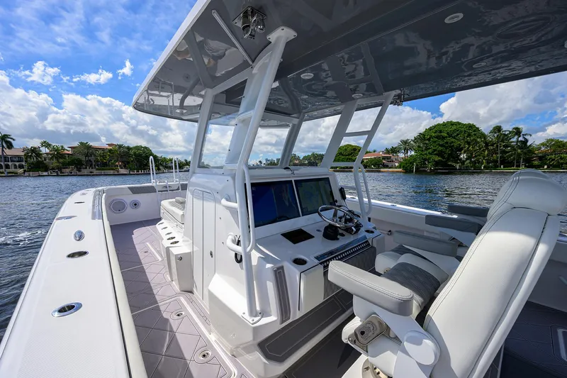 Argento II Yacht Photos Pics 2023 Invincible 46 Catamaran on water, featuring sleek design and modern navigation equipment.