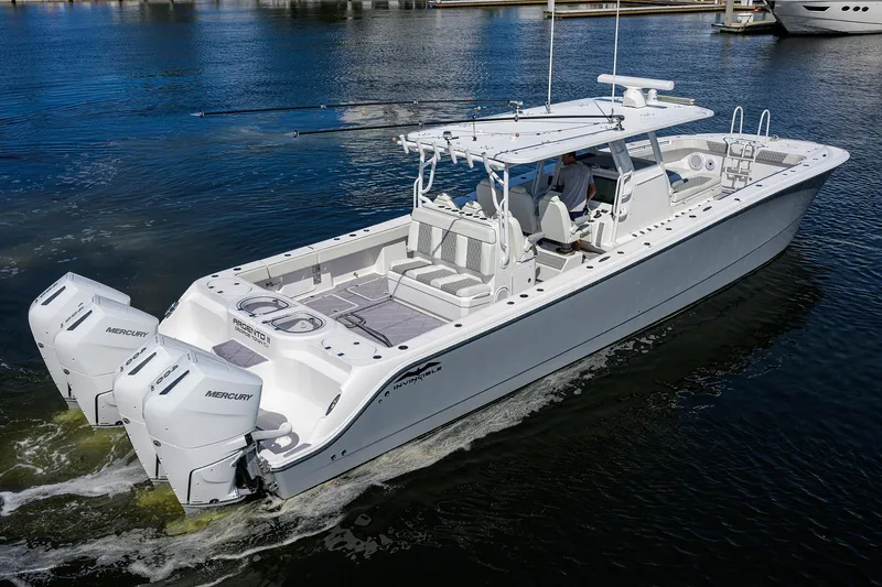 Argento II Yacht Photos Pics 2023 Invincible 46 Catamaran cruising on calm waters, featuring twin Mercury engines.