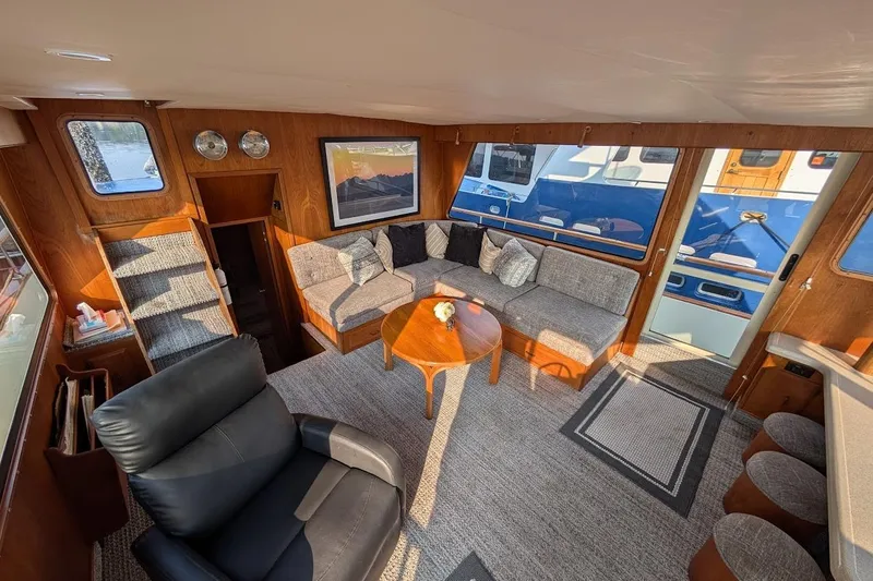 Innovation Yacht Photos Pics Interior of 1978 Tollycraft 54 Custom Cockpit Motor Yacht with cozy seating and elegant decor.