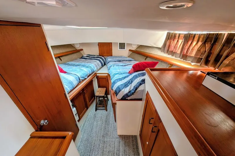 Innovation Yacht Photos Pics 1978 Tollycraft 54 Custom Cockpit Motor Yacht cabin with twin beds and wooden interior.