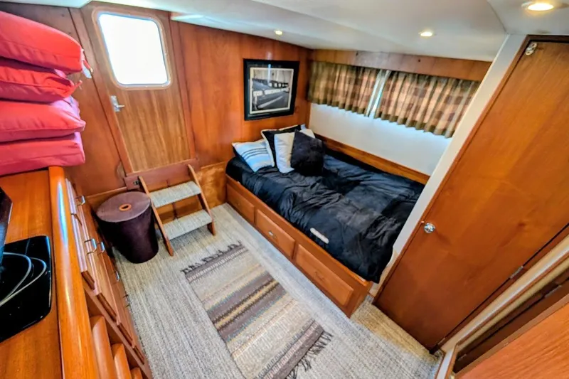 Innovation Yacht Photos Pics Cozy cabin interior of 1978 Tollycraft 54 Custom Cockpit Motor Yacht with wood paneling.