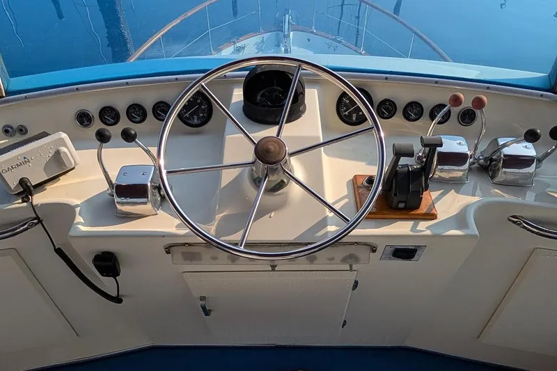 Innovation Yacht Photos Pics 1978 Tollycraft 54 Custom Cockpit Motor Yacht helm with steering wheel and controls.