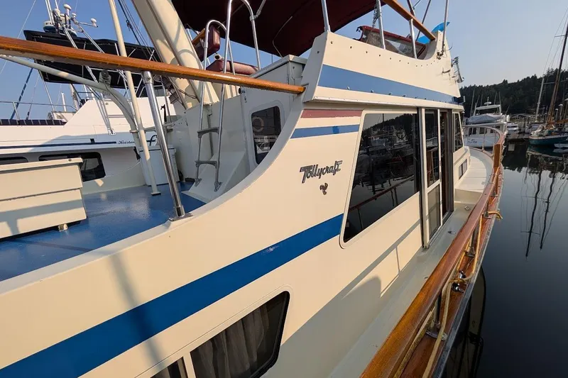 Innovation Yacht Photos Pics 1978 Tollycraft 54 Custom Cockpit Motor Yacht docked in a marina, showcasing sleek design.