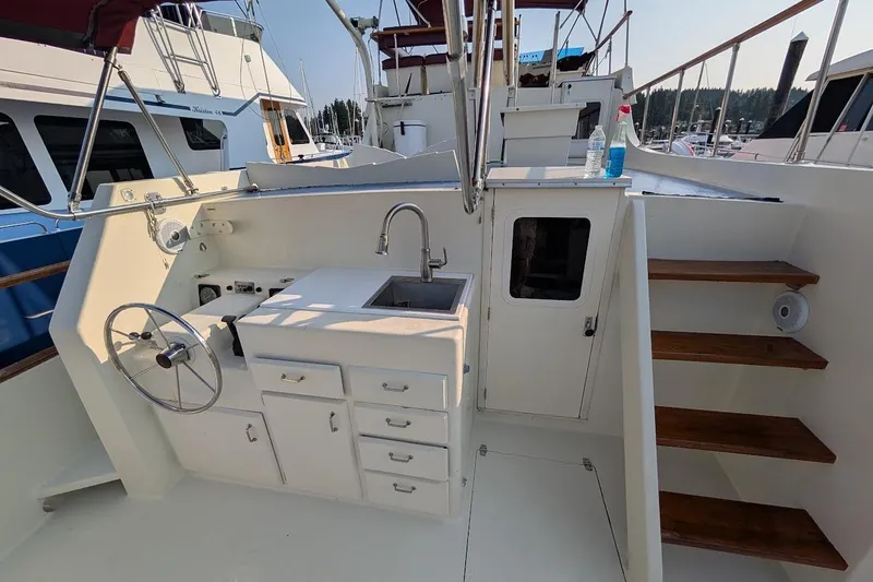 Innovation Yacht Photos Pics 1978 Tollycraft 54 Custom Cockpit Motor Yacht with outdoor sink and steering wheel.