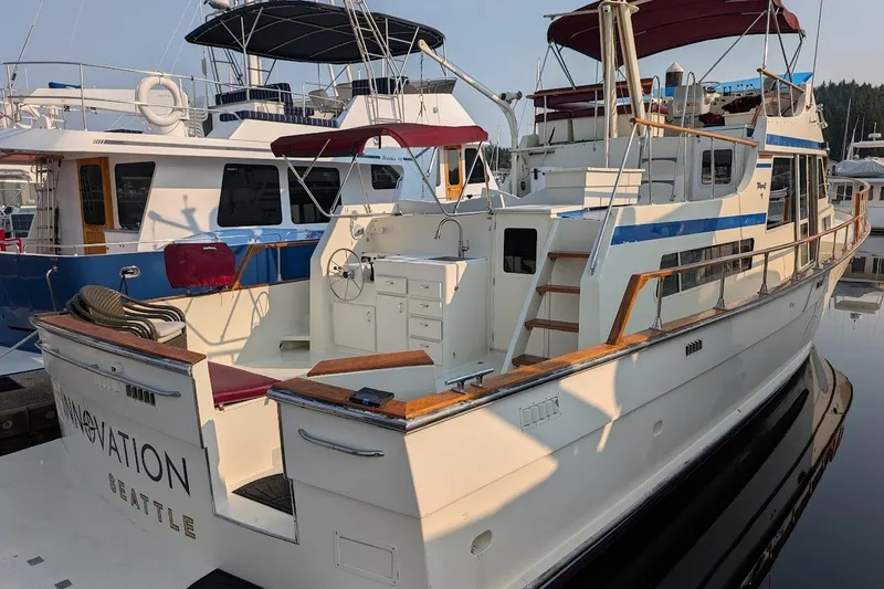 Innovation Yacht Photos Pics 1978 Tollycraft 54 Custom Cockpit Motor Yacht docked in marina, featuring spacious deck.