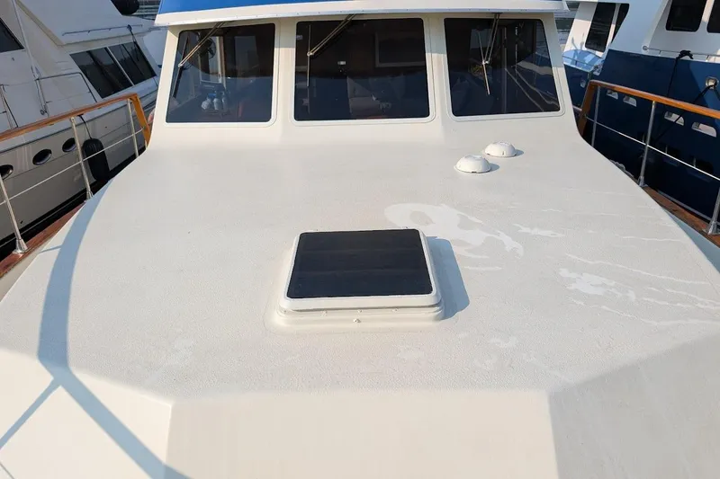 Innovation Yacht Photos Pics 1978 Tollycraft 54 Custom Cockpit Motor Yacht deck with windows and hatch.