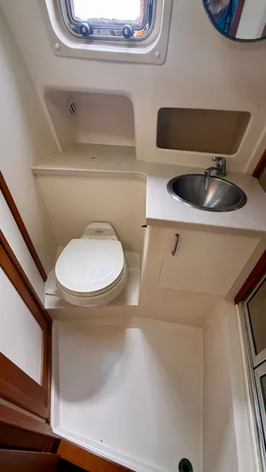 Sabiha Yacht Photos Pics Bathroom in 2004 Mainship 400 Trawler with toilet and sink.