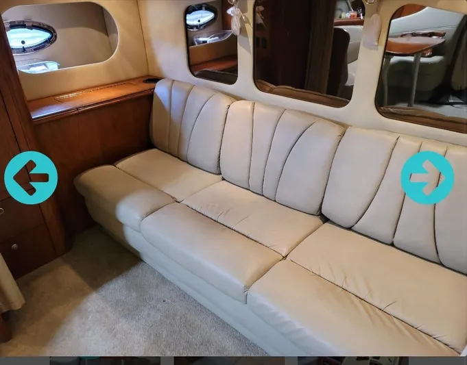  Yacht Photos Pics Luxurious beige leather sofa in 2005 Cruisers Yachts 370 interior cabin.