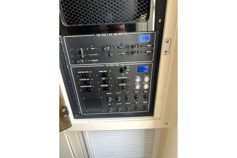 New Trade-in- All Offers & Trades Welcome Yacht Photos Pics Control panel of a 2018 Scout 350 LXF boat, featuring 120V AC and 12V DC systems.