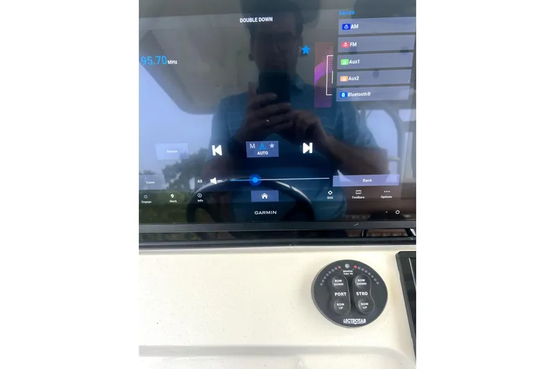 New Trade-in- All Offers & Trades Welcome Yacht Photos Pics 2018 Scout 350 LXF boat dashboard with Garmin display and audio controls.