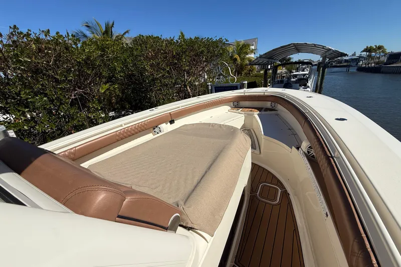 New Trade-in- All Offers & Trades Welcome Yacht Photos Pics 2018 Scout 350 LXF boat with luxurious seating and sleek design by the water.