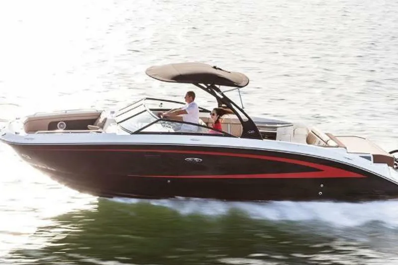 Frisky Yacht Photos Pics 2018 Sea Ray SDX 290 Outboard cruising on water, featuring sleek design and spacious seating.