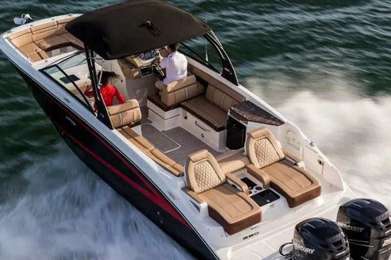 Frisky Yacht Photos Pics 2018 Sea Ray SDX 290 Outboard cruising on water, featuring luxurious seating and dual engines.