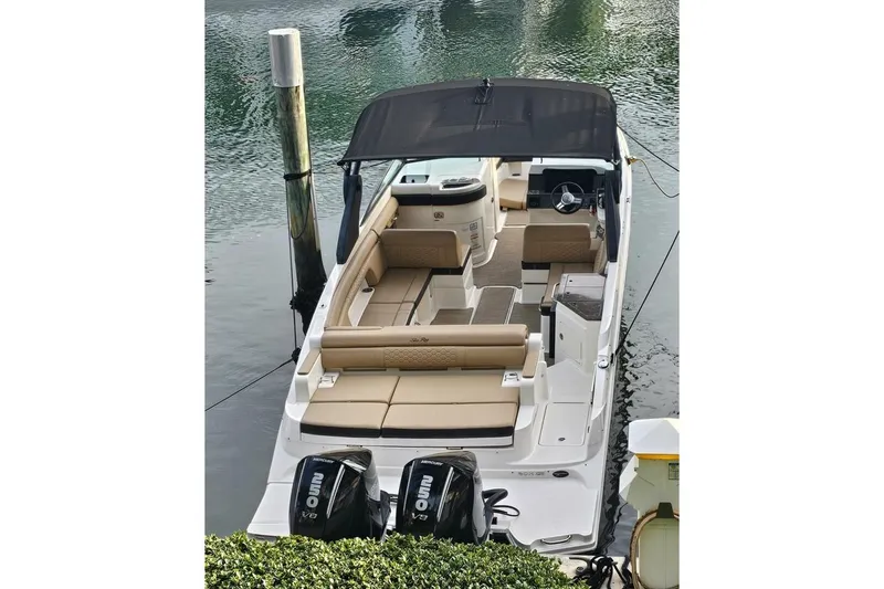 Frisky Yacht Photos Pics 2018 Sea Ray SDX 290 Outboard boat with dual engines, docked in calm waters.