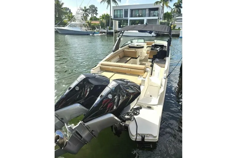 Frisky Yacht Photos Pics 2018 Sea Ray SDX 290 Outboard boat docked in a scenic marina setting.