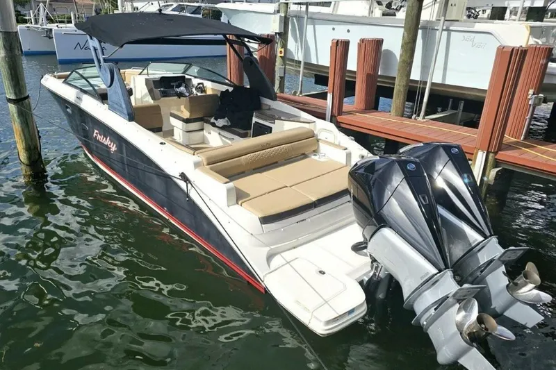 Frisky Yacht Photos Pics 2018 Sea Ray SDX 290 Outboard boat docked, featuring dual engines and spacious seating.