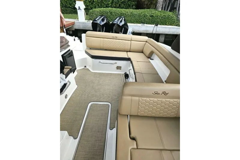 Frisky Yacht Photos Pics 2018 Sea Ray SDX 290 Outboard interior with tan seating and dual outboard engines.