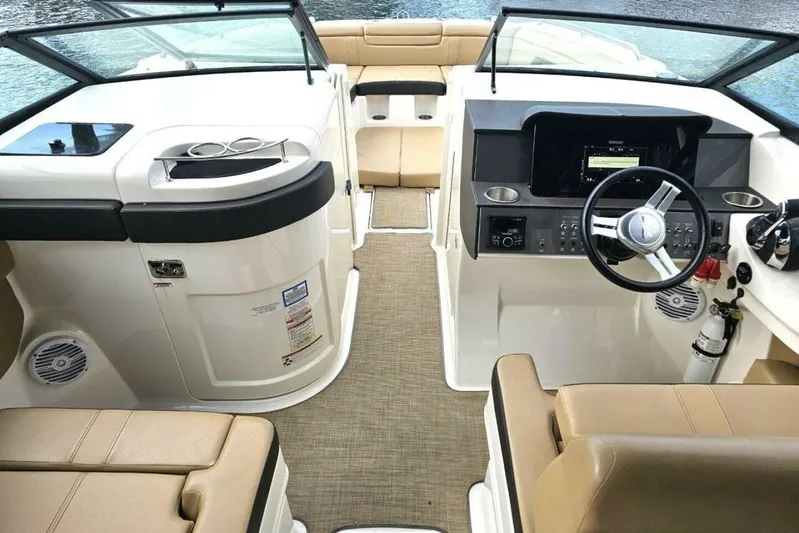 Frisky Yacht Photos Pics 2018 Sea Ray SDX 290 Outboard boat interior with beige seating and modern dashboard.