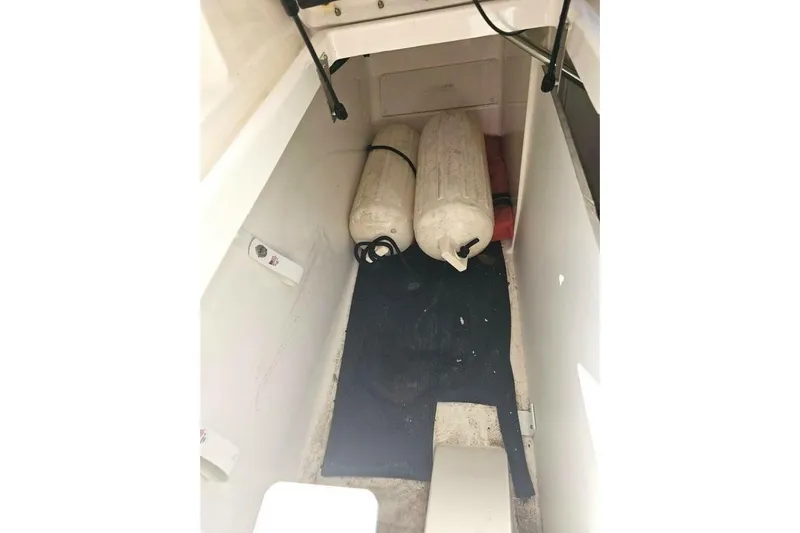 Frisky Yacht Photos Pics Storage compartment of 2018 Sea Ray SDX 290 Outboard with fenders and equipment.