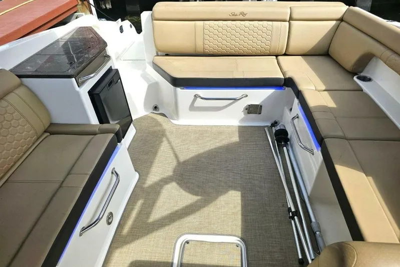 Frisky Yacht Photos Pics 2018 Sea Ray SDX 290 Outboard interior with beige seating and modern amenities.