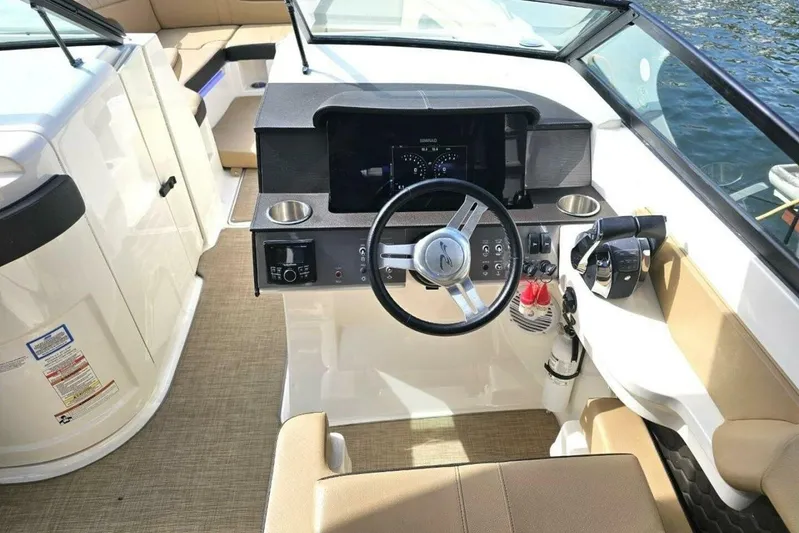 Frisky Yacht Photos Pics 2018 Sea Ray SDX 290 Outboard boat cockpit with steering wheel and control panel.