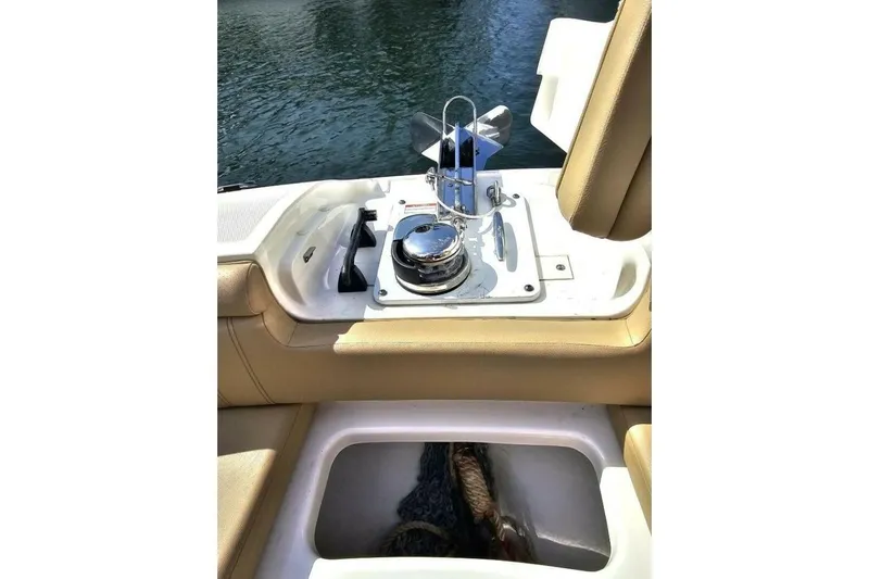 Frisky Yacht Photos Pics 2018 Sea Ray SDX 290 Outboard boat interior with anchor storage and seating.