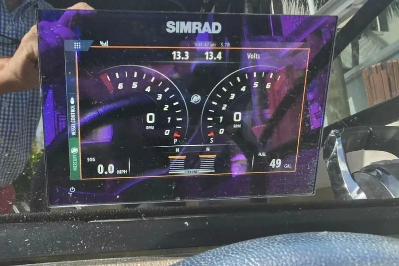 Frisky Yacht Photos Pics Simrad display on 2018 Sea Ray SDX 290 Outboard showing RPM, speed, and fuel levels.