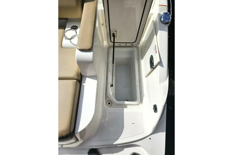 Frisky Yacht Photos Pics 2018 Sea Ray SDX 290 Outboard boat storage compartment with beige seating.
