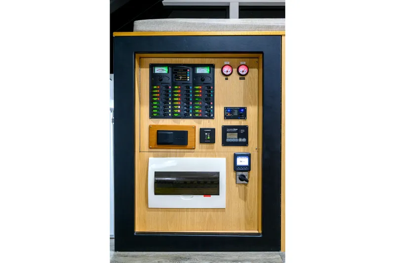 One Off Yacht Photos Pics Electrical control panel on 2019 Coral Coast 62 Power Catamaran, featuring gauges and switches.