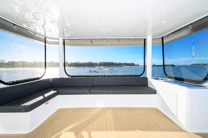 One Off Yacht Photos Pics Luxurious interior of 2019 Coral Coast 62 Power Catamaran with panoramic ocean views.