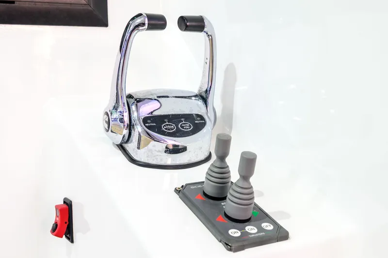 One Off Yacht Photos Pics Control panel of 2019 Coral Coast 62 Power Catamaran with throttle and joystick controls.