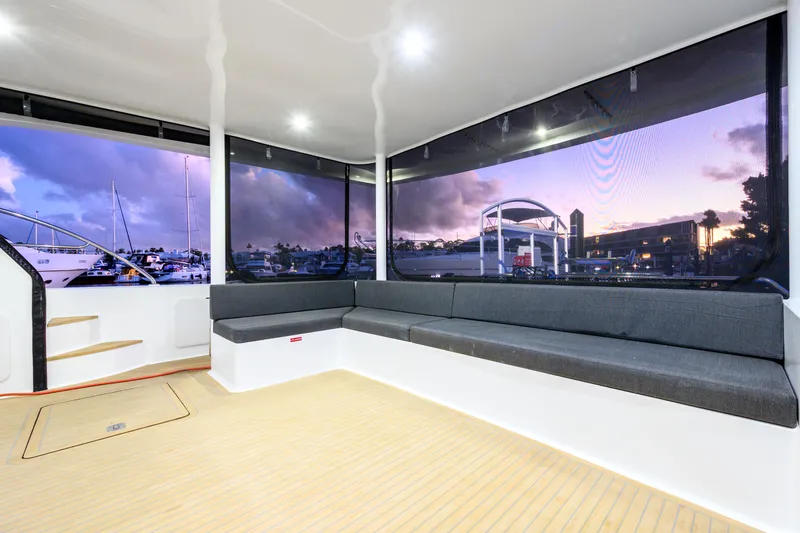 One Off Yacht Photos Pics Luxurious interior of 2019 Coral Coast 62 Power Catamaran with panoramic marina view.