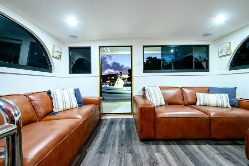 One Off Yacht Photos Pics Luxurious interior of 2019 Coral Coast 62 Power Catamaran with leather sofas and modern decor.