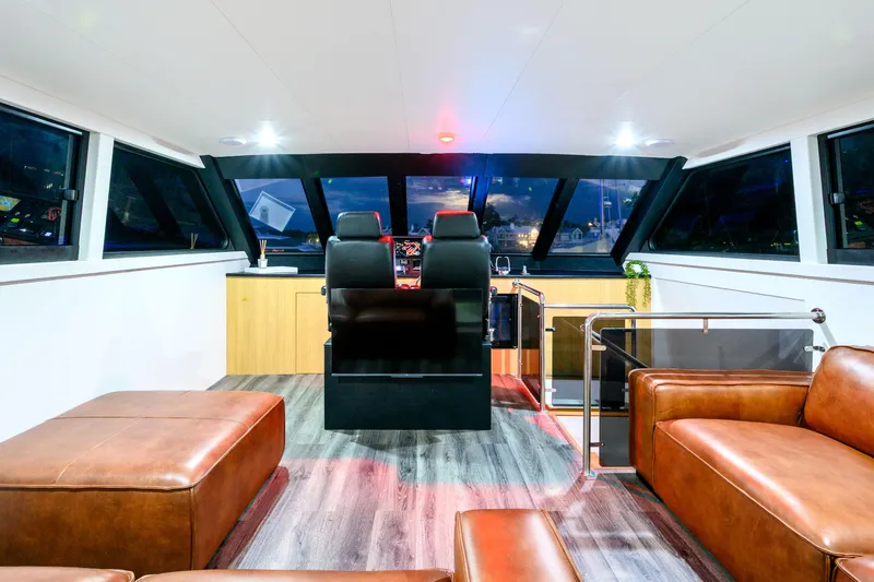 One Off Yacht Photos Pics Luxurious interior of 2019 Coral Coast 62 Power Catamaran with leather seating and panoramic windows.