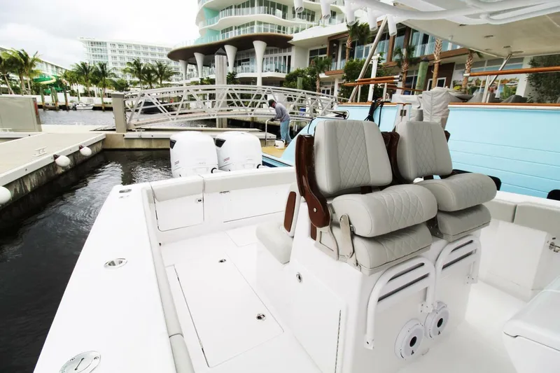  Yacht Photos Pics 2024 Jupiter 34 HFS boat with luxurious seating at a marina.