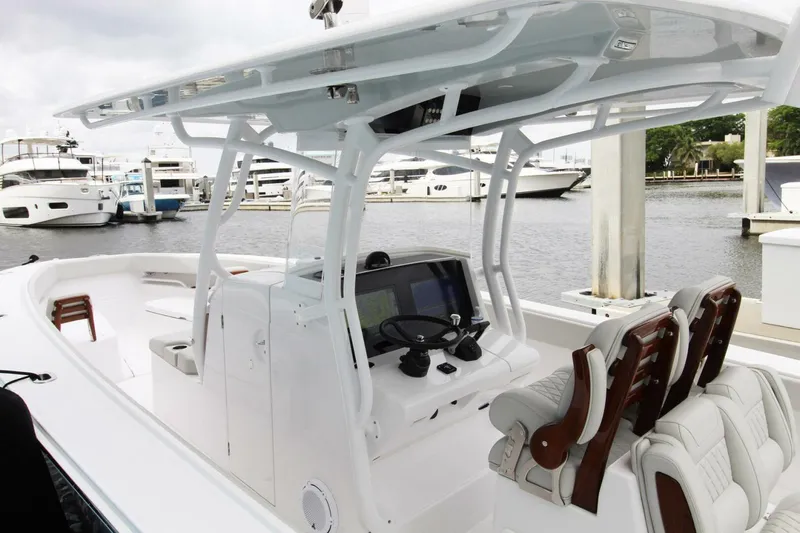  Yacht Photos Pics 2024 Jupiter 34 HFS boat interior with helm, seating, and marina view.