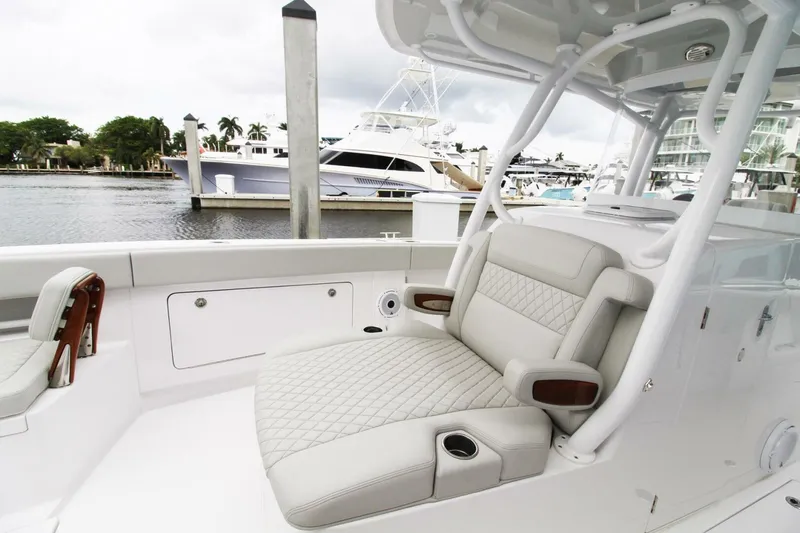  Yacht Photos Pics 2024 Jupiter 34 HFS boat with luxurious seating at a marina.