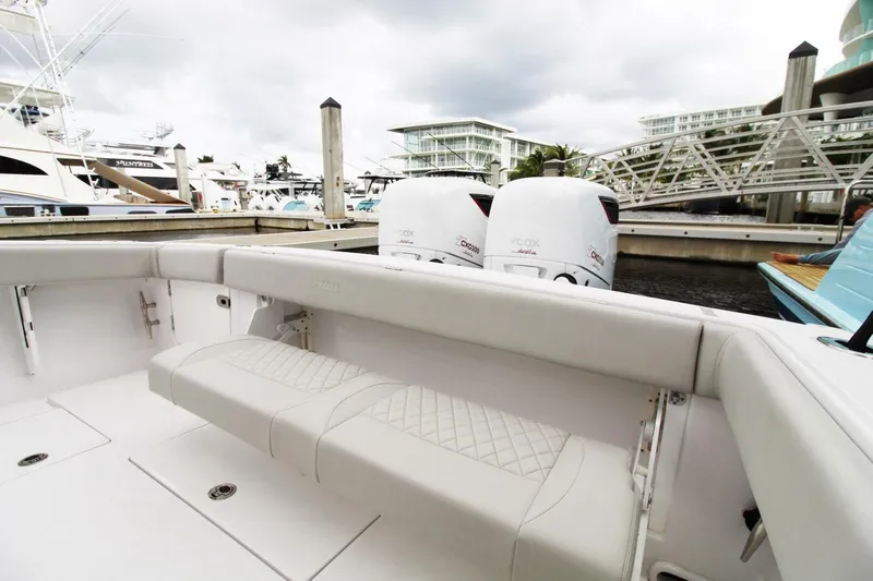  Yacht Photos Pics 2024 Jupiter 34 HFS boat with twin outboard engines docked at a marina.