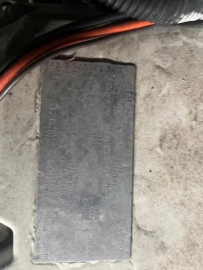 Papa's 7 II Yacht Photos Pics Close-up of a metal identification plate on a 1995 Sea Ray 440 Express Bridge.