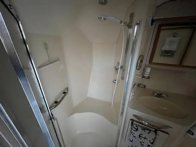 Papa's 7 II Yacht Photos Pics Bathroom interior of 1995 Sea Ray 440 Express Bridge yacht with shower and sink.