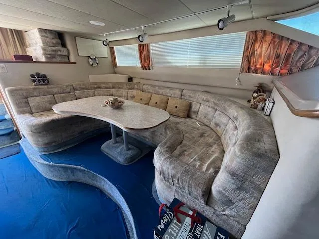 Papa's 7 II Yacht Photos Pics Luxurious interior of 1995 Sea Ray 440 Express Bridge with plush seating and elegant decor.