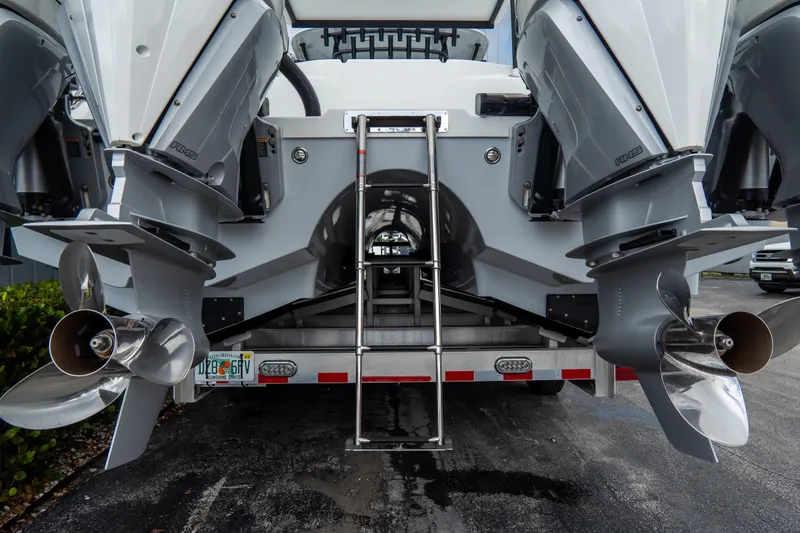  Yacht Photos Pics 2024 Freeman 38 boat with dual outboard motors and stainless steel ladder.